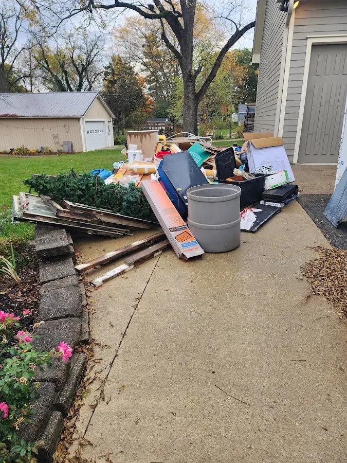 Dumpster being loaded with debris for 10 Yard Dumpster Rental in Hackensack